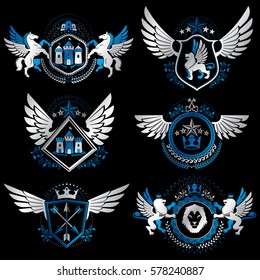 Vintage decorative heraldic vector emblems composed with elements like eagle wings, religious crosses, armory and medieval castles, animals. Collection of classy symbolic illustrations. 