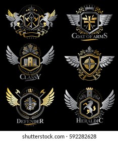 Vintage decorative heraldic vector emblems composed with elements like eagle wings, religious crosses, armory and medieval castles, animals. Collection of classy symbolic illustrations. 