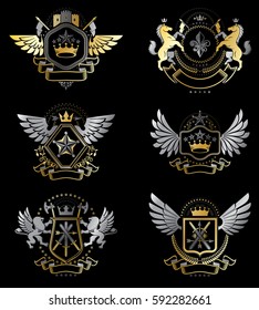 Vintage decorative heraldic vector emblems composed with elements like eagle wings, religious crosses, armory and medieval castles, animals. Collection of classy symbolic illustrations. 