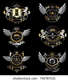 Vintage decorative heraldic vector emblems composed with elements like eagle wings, religious crosses, armory and medieval castles, animals. Collection of classy symbolic illustrations. 