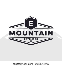 Vintage Emblem Badge Letter E Mountain Typography Logo for Outdoor Adventure Expedition, Mountains Silhouette Shirt, Print Stamp Design Template Element