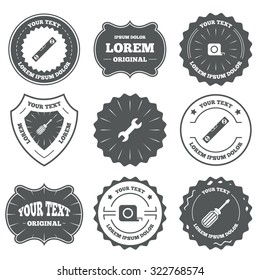 Vintage emblems, labels. Screwdriver and wrench key tool icons. Bubble level and tape measure roulette sign symbols. Design elements. Vector