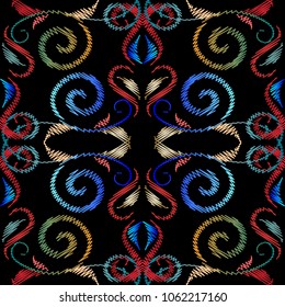 Vintage embroidery vector seamless pattern. Renaissance style swirl line art tracery tapestry ornaments. Embroidered colorful damask flowers, swirl lines, curves, leaves. Floral fancywork background.
