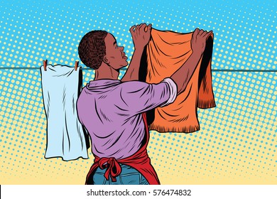 Vintage employee hangs up to dry clothes. pop art retro vector illustration. Homework and cleaning service. African American people