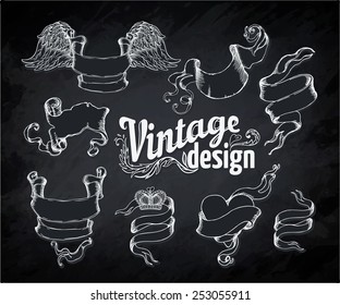 Vintage engraved decorative ornate vector design elements. Chalk illustration over a blackboard 