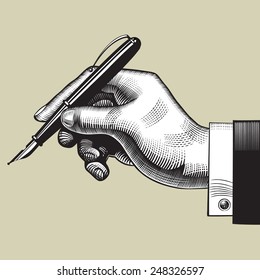 Vintage engraving drawing of hand with a pen. Vector illustration