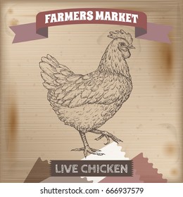 Vintage farmers market label with live chicken. Placed on wooden texture. Includes hand drawn elements.