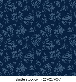 Vintage floral background. Floral pattern with flowers drawn in blue silhouette on a dark blue background. Seamless pattern for design and fashion prints. Liberty style. Stock vector illustration.