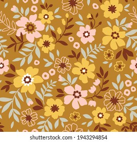 Vintage floral background. Floral pattern with small yellow and pink  flowers on a old gold background. Seamless pattern for design and fashion prints. Ditsy style. Stock vector illustration.