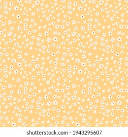Vintage floral background. Floral pattern with small white flowers on a pale yellow background. Seamless pattern for design and fashion prints. Ditsy style. Stock vector illustration.