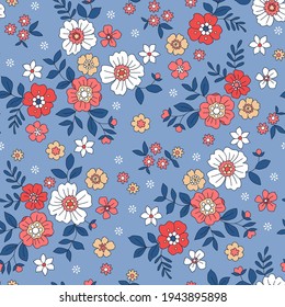 Vintage floral background. Floral pattern with small white and red  flowers on a pale blue background. Seamless pattern for design and fashion prints. Ditsy style. Stock vector illustration.