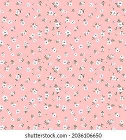 Vintage floral background. Floral pattern with small white flowers on alight pink background. Seamless pattern for design and fashion prints. Ditsy style. Stock vector illustration.