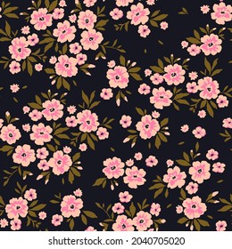 Fondo floral vintage. Patrón floral con flores rosadas pequeñas sobre un fondo negro. Patrón sin inconvenientes para el diseño y las impresiones de moda. Estilo marrón. Ilustración vectorial de material.