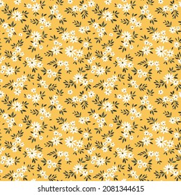  Vintage floral background. Floral pattern with small white flowers on a light yellow background. Seamless pattern for design and fashion prints. Ditsy style. Stock vector illustration.
