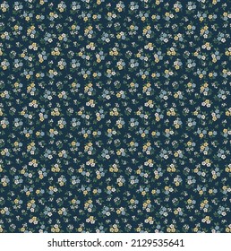 Vintage floral background. Floral pattern with small blue, yellow and white flowers on a dark blue background. Seamless pattern for design and fashion prints. Ditsy style. Stock vector illustration.