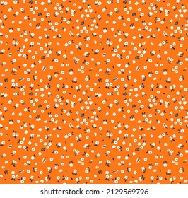 Vintage floral background. Floral pattern with small white flowers on a orange background. Seamless pattern for design and fashion prints. Ditsy style. Stock vector illustration.