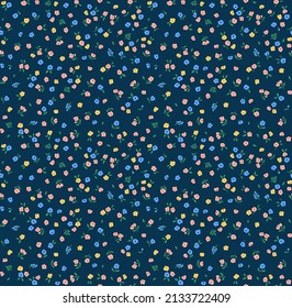 Vintage floral background. Floral pattern with small colorful flowers on a dark blue background. Seamless pattern for design and fashion prints. Ditsy style. Stock vector illustration.
