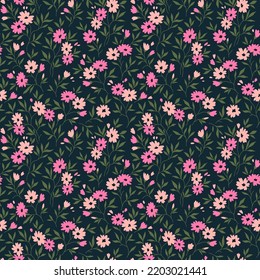 Vintage floral background. Floral pattern with small purple lilac flowers on a dark blue background. Seamless pattern for design and fashion prints. Ditsy style. Stock vector illustration.