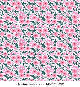 Vintage floral background. Seamless vector pattern for design and fashion prints. Flowers pattern with small pink flowers on a white background. Ditsy style.