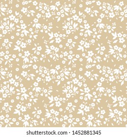 Vintage floral background. Seamless vector pattern for design and fashion prints. Flowers pattern with small white flowers on a ivory background. Ditsy style.