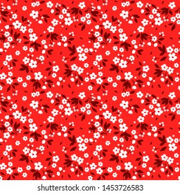 Vintage floral background. Seamless vector pattern for design and fashion prints. Flowers pattern with small white flowers on a red background. Ditsy style.