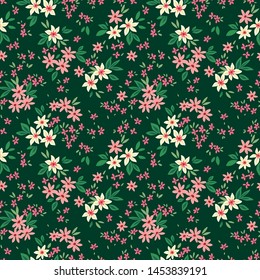 Vintage floral background. Seamless vector pattern for design and fashion prints. Flowers pattern with small pink and white flowers on a dark green background. Ditsy style.
