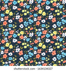 Vintage floral background. Seamless vector pattern for design and fashion prints. Flowers pattern with small colorful flowers on a dark blue  background. Ditsy style.
