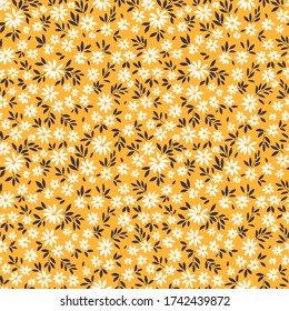 Vintage floral background. Seamless vector pattern for design and fashion prints. Flowers pattern with small white flowers on a yellow background. Ditsy style.