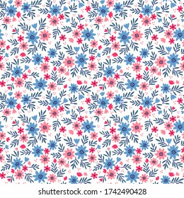 Vintage floral background. Seamless vector pattern for design and fashion prints. Flowers pattern with small red and blue flowers on a white background. Ditsy style.