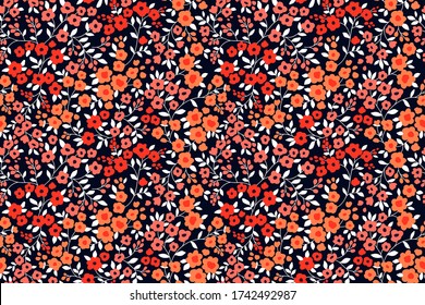 Vintage floral background. Seamless vector pattern for design and fashion prints. Flowers pattern with small orange and red flowers on a dark blue background. Ditsy style.