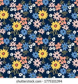 Vintage floral background. Seamless vector pattern for design and fashion prints. Flowers pattern with small colorful flowers on a dark blue background. Ditsy style.