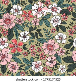 Vintage floral background. Seamless vector pattern for design and fashion prints. Flowers pattern with small pink and red flowers on a light green background. Ditsy style.