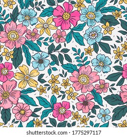 Vintage floral background. Seamless vector pattern for design and fashion prints. Flowers pattern with small colorful flowers on a white background. Ditsy style.