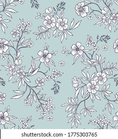 Vintage floral background. Seamless vector pattern for design and fashion prints. Flowers pattern with small white flowers on a light blue background. Ditsy style.