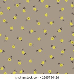 Vintage floral background. Seamless vector pattern for design and fashion prints. Floral pattern with small yellow flowers on a gray background.
