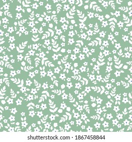 Fondo floral vintage. Patrón vectorial transparente para el diseño y las impresiones de moda. Flores con flores blancas pequeñas sobre un fondo verde. Estilo marrón. Vector de material.