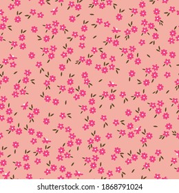 Fondo floral vintage. Patrón vectorial transparente para el diseño y las impresiones de moda. Flores con flores rosadas pequeñas sobre un fondo rosa claro. Estilo marrón.