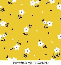 Vintage floral background. Seamless vector pattern for design and fashion prints. Elegant floral pattern with white flowers on a yellow background.