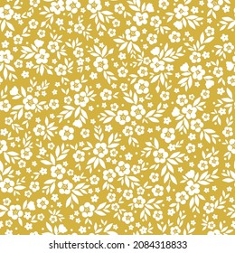 Fondo floral vintage. Patrón vectorial transparente para el diseño y las impresiones de moda. Patrón floral con flores blancas y hojas sobre un fondo mostaza.