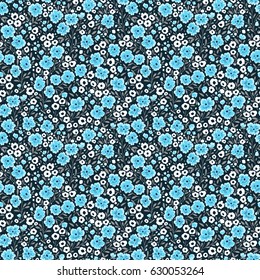 Vintage floral background. Seamless vector pattern for design and fashion prints. Flowers pattern with small blue flowers on a navy blue background. Ditsy style. 