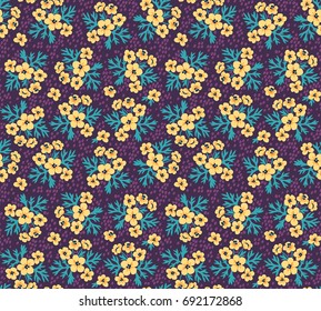Vintage floral background. Seamless vector pattern for design and fashion prints. Flowers pattern with small yellow flowers on a dark violet background. Ditsy style. 