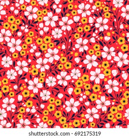 Vintage floral background. Seamless vector pattern for design and fashion prints. Flowers pattern with small white and yellow flowers on a red background. Ditsy style. 