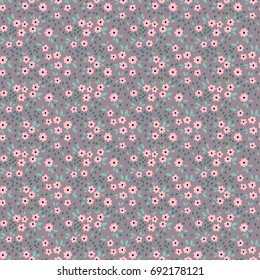 Vintage floral background. Seamless vector pattern for design and fashion prints. Flowers pattern with small pink flowers on a lilac background. Ditsy style. 