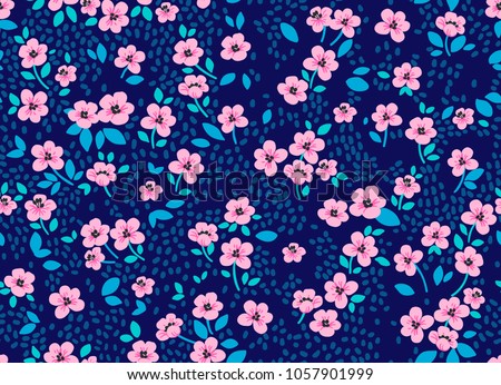 Vintage floral background. Seamless vector pattern for design and fashion prints. Flowers pattern with small pink flowers on a dark blue background. Ditsy style. 