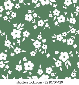 Vintage floral background with white flowers and leaves. green background. Seamless pattern for design and fashion prints.Stock vector illustration.