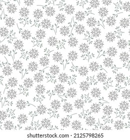 Vintage floral pattern with small grey flowers on white background. Seamless pattern for design and fashion prints. Ditsy style.