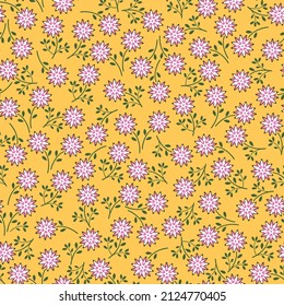 Vintage floral pattern with small pink  and white flowers on yellow background. Seamless pattern for design and fashion prints. Ditsy style.