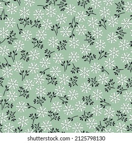 Patrón floral vintage con flores pequeñas blancas y verdes oscuras sobre fondo verde claro. Patrón sin inconvenientes para el diseño y las impresiones de moda. Estilo marrón.
