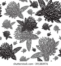 Vintage floral seamless pattern with engraved black clovers on dark background