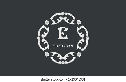 Vintage flower monogram with the letter E. Exquisite three-dimensional logo. Luxury frame for business sign, label, boutique brand, hotel, restaurant, heraldry.